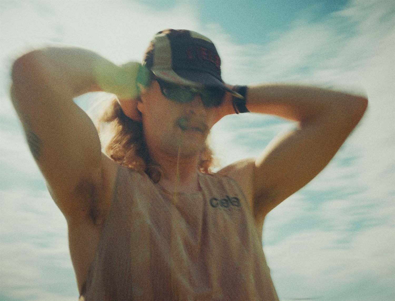 Portrait of an athlete, hands behind head